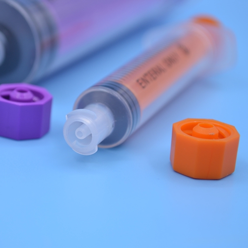 Disposable feeding tube syringe