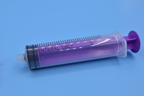 Disposable feeding tube syringe